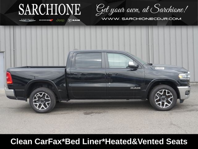 2025 RAM 1500 Laramie in Diamond Black Crystal Pearlcoat — front three-quarter view
