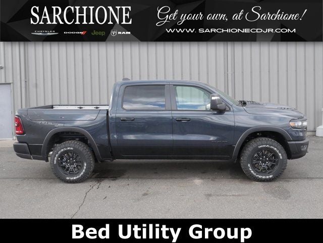 2026 RAM Ram 1500 Rebel in Forged Blue Metallic — front three-quarter view