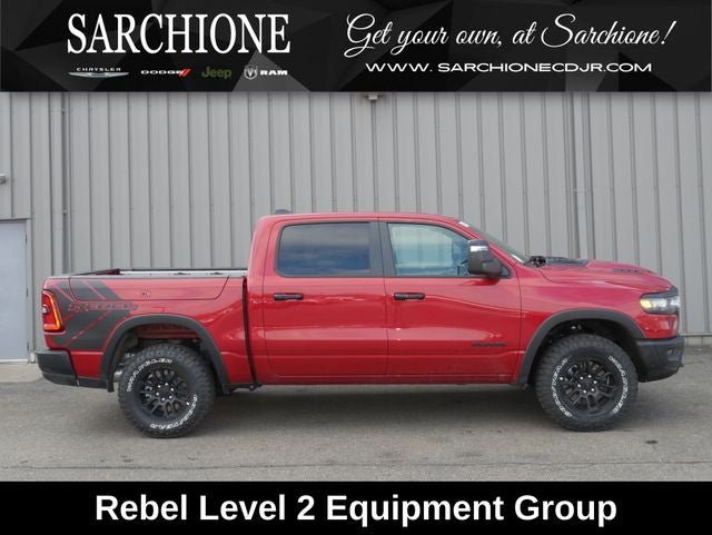 2026 RAM Ram 1500 Rebel in Molten Red Pearlcoat — front three-quarter view