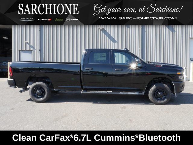 2026 RAM 2500 Tradesman in Diamond Black Crystal Pearlcoat — front three-quarter view